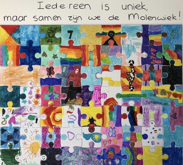 A puzzle put together where a child decorated each piece on their own. The pieces do not form a larger image, but they fit together to show how we are all unique and part of what makes de Molenwiek great. Handwritten text at the top reads "Iedereen is uniek, maar samen zÿn we de Molenwiek!"